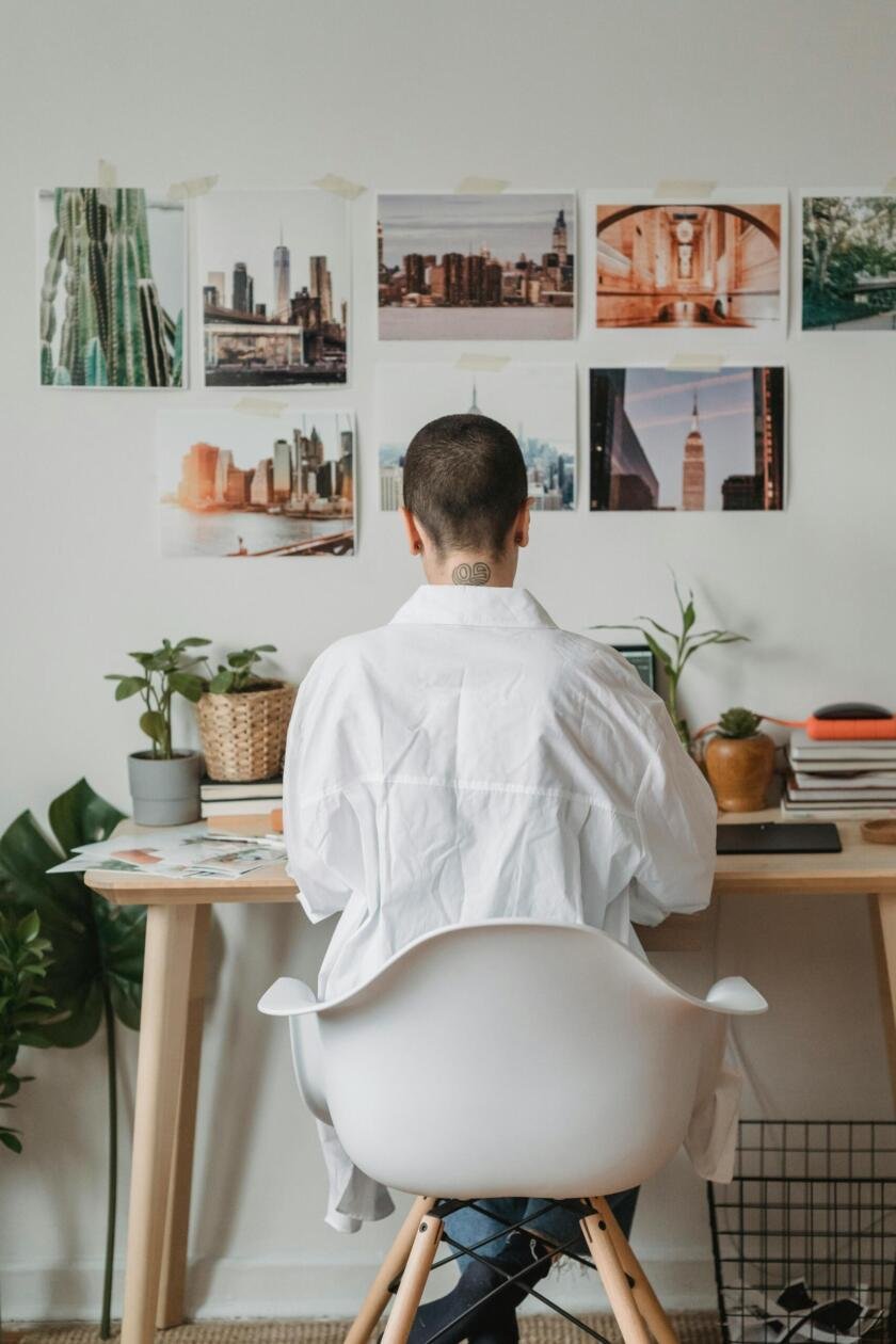 Adult content creator setting up an OnlyFans account on a laptop in a home office