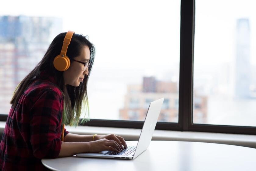 Adult content creator reading about the TAKE IT DOWN Act on a laptop